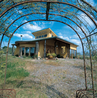 Varying roof overhangs create different microclimates around the house.